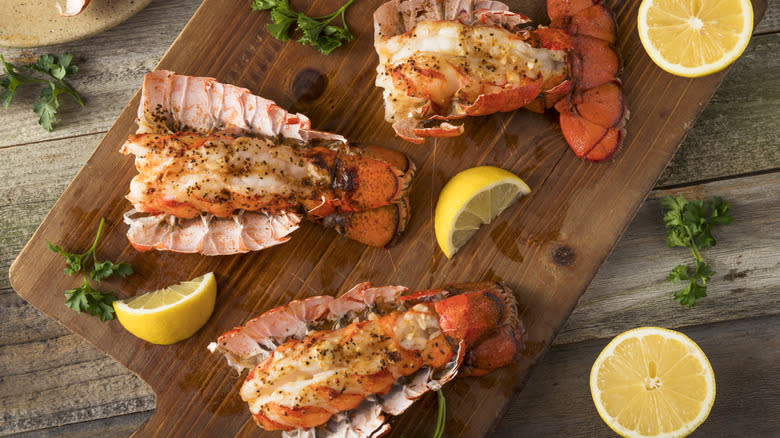 lobster tails on cutting board