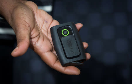 FILE PHOTO: New York City Public Advocate Letitia James displays a body-mounted camera during a news conference in New York, U.S. on August 21, 2014. REUTERS/Brendan McDermid/File Photo