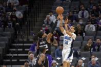 Orlando Magic guard Cole Anthony (50) has his shot blocked by Sacramento Kings center Richaun Holmes (22) during the first quarter of an NBA basketball game in Sacramento, Calif., Wednesday, Dec. 8, 2021. (AP Photo/Jose Luis villegas)