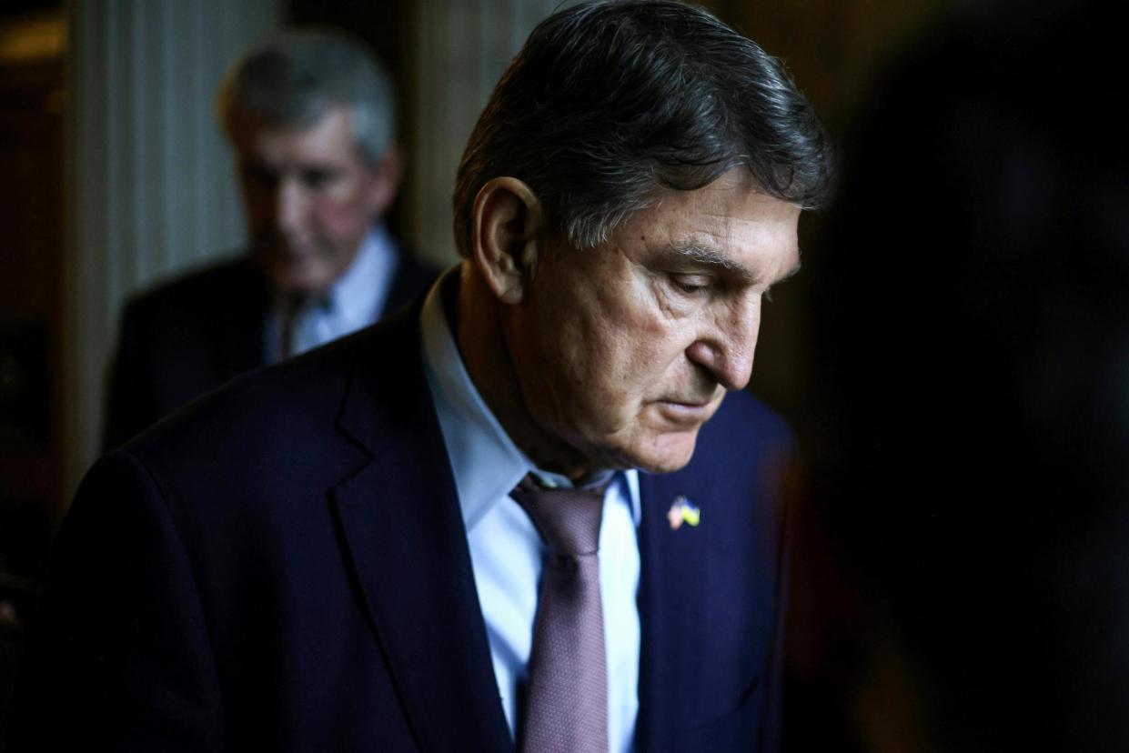 <span>Senator Joe Manchin leaves the Senate chamber on 12 February.</span><span>Photograph: Alex Wong/Getty Images</span>