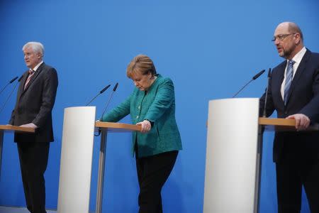 Christian Democratic Union (CDU) leader and German Chancellor Angela Merkel, Christian Social Union (CSU) leader Horst Seehofer and Social Democratic Party (SPD) leader Martin Schulz give a statement after coalition talks to form a new coalition government in Berlin, Germany, February 7, 2018.