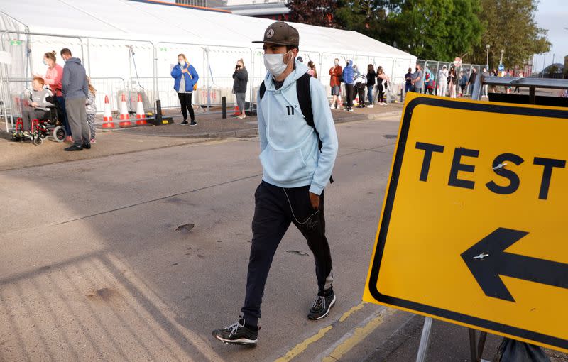 People queue outside a test centre in Southend-on-sea