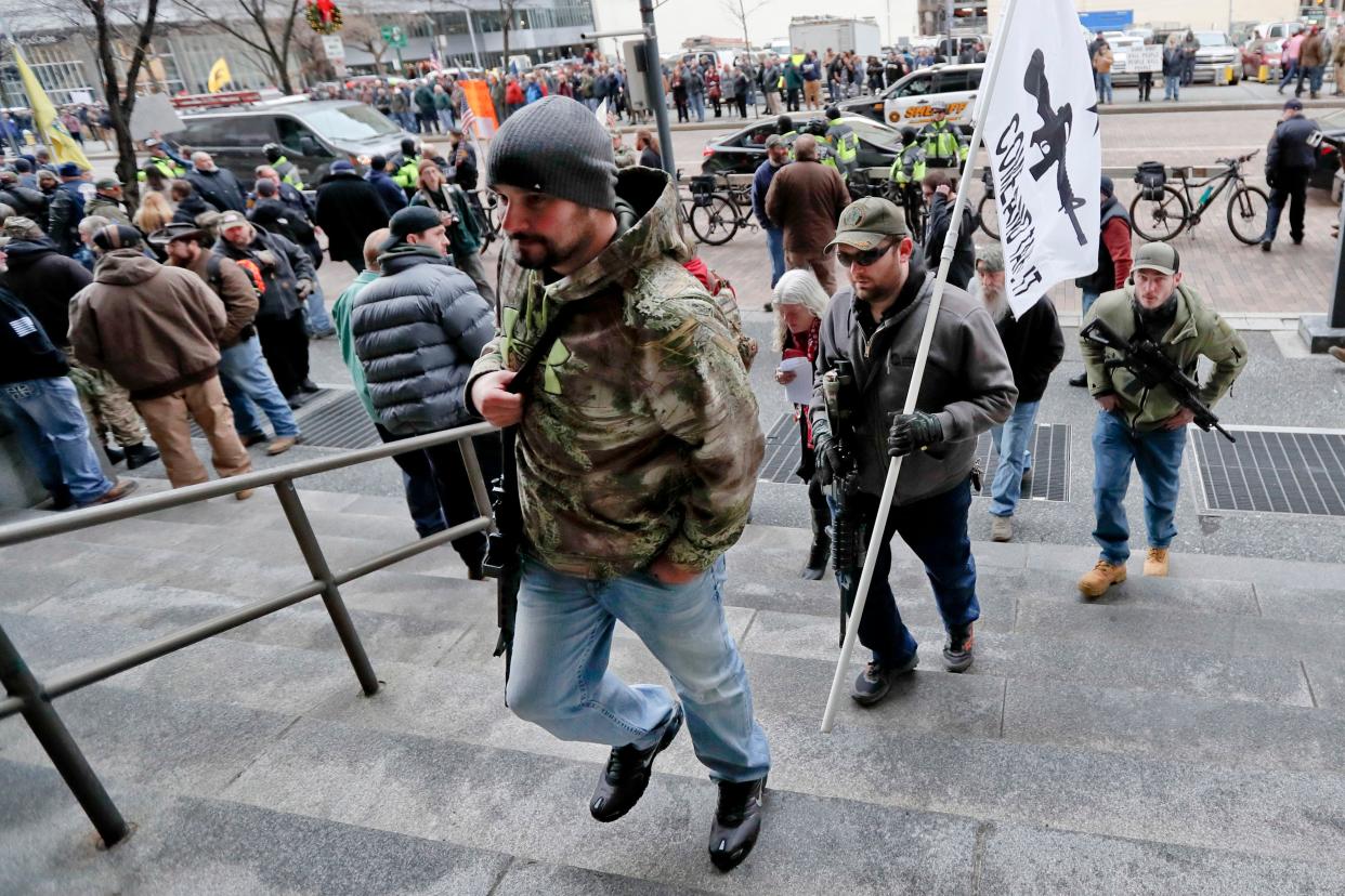 Gun owners protest in Pittsburgh earlier this month against the city council's proposed restrictions, which followed the October 2018 shooting deaths of 11 people at a local synagogue.