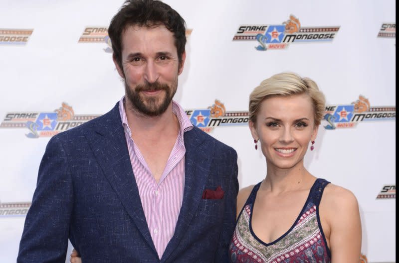 Noah Wyle (L) and his wife, Sara Wells, attend the premiere of the film "Snake and Mongoose" at the Egyptian Theatre in Hollywood in 2013. File Photo by Phil McCarten/UPI