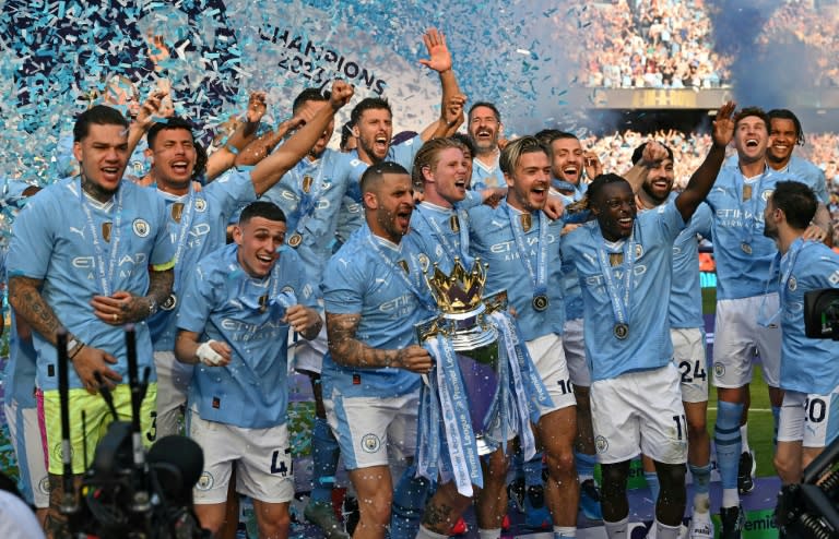 <a class="link " href="https://sports.yahoo.com/soccer/teams/man-city/" data-i13n="sec:content-canvas;subsec:anchor_text;elm:context_link" data-ylk="slk:Manchester City;sec:content-canvas;subsec:anchor_text;elm:context_link;itc:0">Manchester City</a> won a historic fourth successive Premier League title on Sunday (Oli SCARFF)