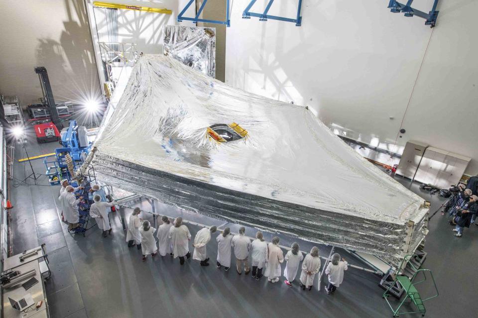 The Sunshield test unit to be used on NASA's James Webb Space Telescope is stacked and expanded at a cleanroom in the Northrop Grumman facility in Redondo Beach, California, in this NASA handout picture released July 25, 2014. The Sunshield separates the observatory into a warm sun-facing side and a cold side where the sunshine is blocked from interfering with the sensitive infrared instruments. REUTERS/NASA/Chris Gunn/Handout (UNITED STATES - Tags: SCIENCE TECHNOLOGY) ATTENTION EDITORS - THIS PICTURE WAS PROVIDED BY A THIRD PARTY. REUTERS IS UNABLE TO INDEPENDENTLY VERIFY THE AUTHENTICITY, CONTENT, LOCATION OR DATE OF THIS IMAGE. THIS PICTURE IS DISTRIBUTED EXACTLY AS RECEIVED BY REUTERS, AS A SERVICE TO CLIENTS. FOR EDITORIAL USE ONLY. NOT FOR SALE FOR MARKETING OR ADVERTISING CAMPAIGNS