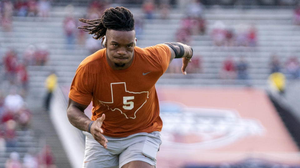NFL teams don't value running backs like they used to, which is tough news for elite NFL Draft prospect Bijan Robinson of Texas.  (AP Photo/Jeffrey McWhorter)
