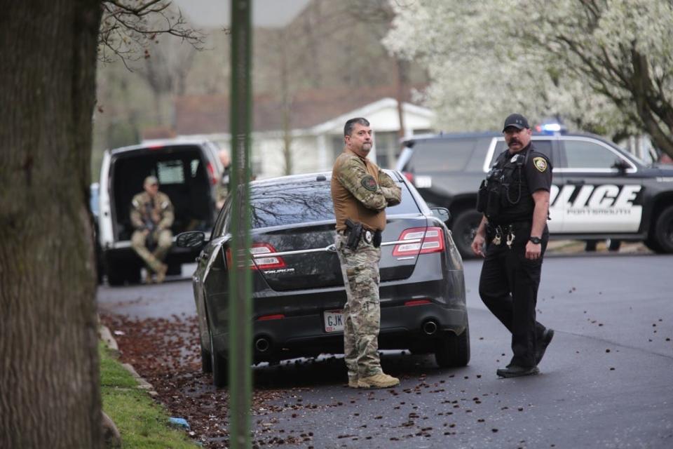 The streets surrounding Michael Mearan's home near the Scioto County Courthouse in Ohio are blocked by police vehicles and flooded with police personnel March 25.