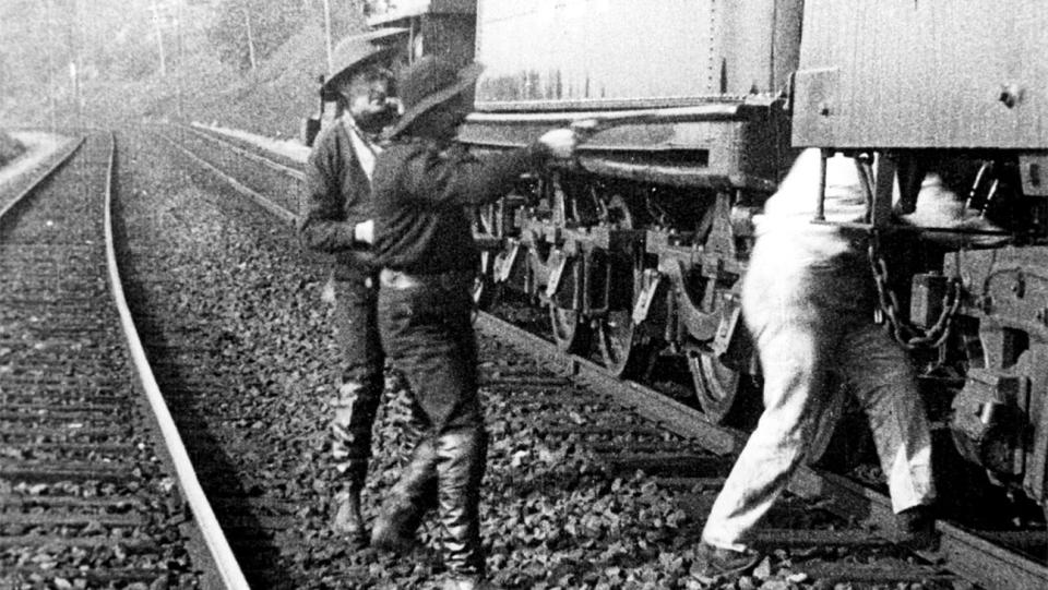 Robbers hold up the train in GREAT TRAIN ROBBERY, 1903.