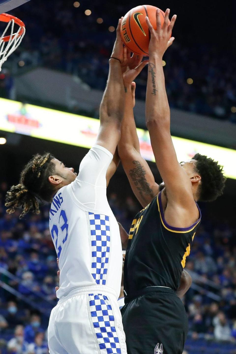 Kentucky’s Bryce Hopkins blocks a shot by Albany center Paul Newman. Coach John Calipari has talked about the 6-foot-6 Hopkins becoming a post presence for the Wildcats.