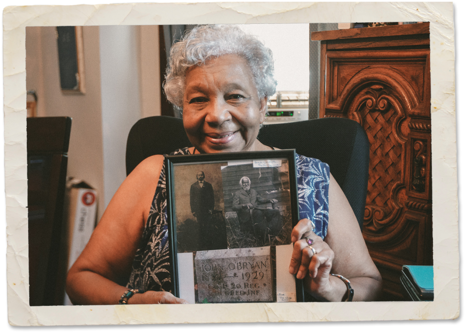 Martha Woods, a resident of La Mott since the 1980s, showing photos of her great-grandfather who fought in the Civil War and trained at Camp William Penn.