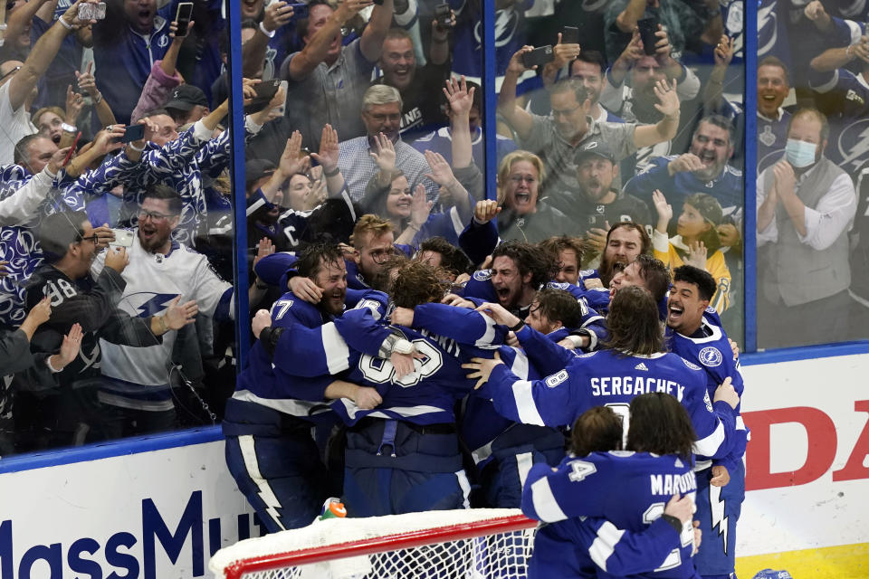 FILE - In this July 7, 2021, file photo, the Tampa Bay Lightning celebrate their series win over the Montreal Canadiens to clinch the Stanley Cup in Game 5 of the NHL hockey finals in Tampa, Fla. (AP Photo/Gerry Broome, File)