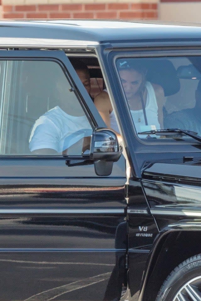 Katie Holmes sits on Jamie Foxx's lap in Marietta, Georgia.