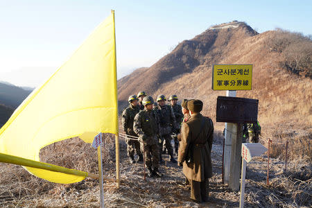 Soldiers from North and South Korea verify the removal of guard posts on each side of the Demilitarized Zone, December 12, 2018. South Korean Defence Ministry/Handout via REUTERS