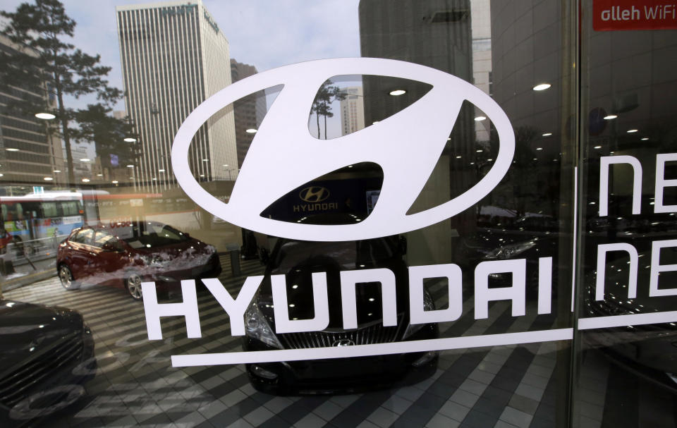 The logo of Hyundai Motor Co. is displayed at the automaker's showroom in Seoul, South Korea, Thursday, Jan. 23, 2014. Hyundai Motor Co. said its fourth-quarter profit increased 13 percent over a year earlier thanks to higher overseas sales. (AP Photo/Lee Jin-man)