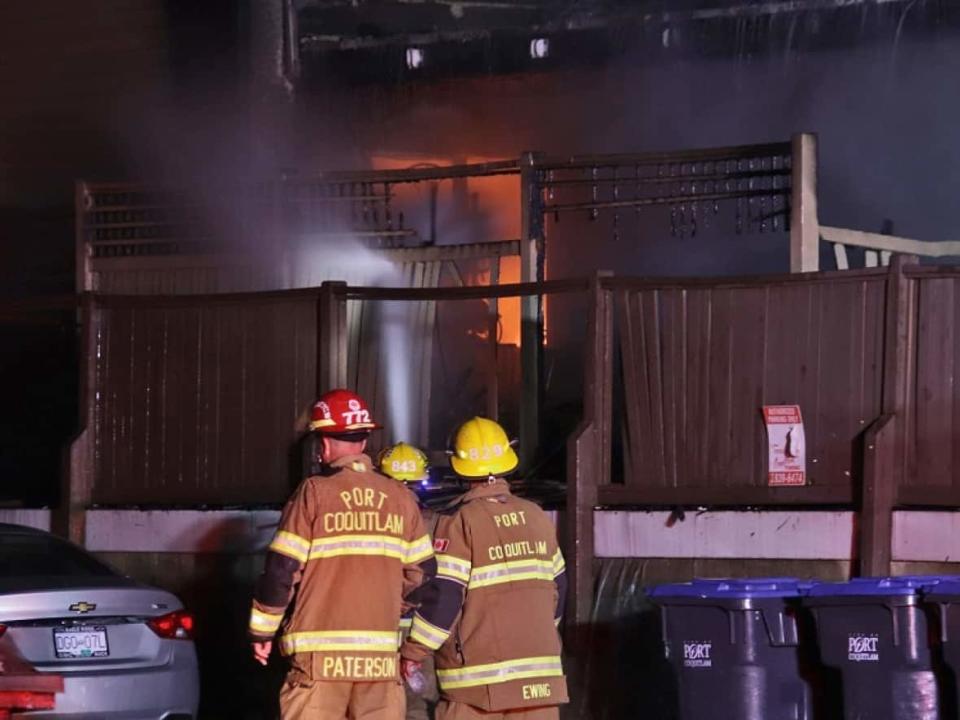 Firefighters respond to a fire at an apartment complex in Port Coquitlam, B.C. on June 25, 2022. Two people were injured in the blaze. (Shane MacKichan - image credit)