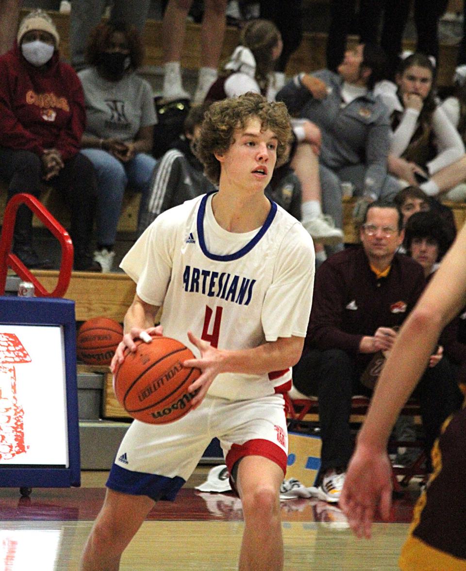 Martinsville junior Brody Staggs looks for an open teammate during Friday's game at home against Bloomington North. 