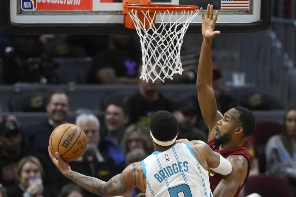 Cleveland Cavaliers forward Evan Mobley (4) defends a shot by Charlotte Hornets forward Miles Bridges (0) in the first quarter at Rocket Mortgage FieldHouse.