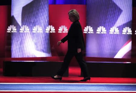 Democratic U.S. presidential candidate and former Secretary of State Hillary Clinton walks across the stage during a break at the NBC News - YouTube Democratic presidential candidates debate in Charleston, South Carolina January 17, 2016. REUTERS/Randall Hill