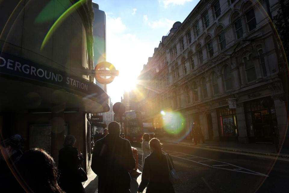 Pedestrians walks past a tube station, in central London January 18, 2011.  A record monthly jump in prices drove British inflation to an 8-month high in December, piling pressure on the Bank of England to raise interest rates and show it is not letting inflation get out of control.    REUTERS/Stefan Wermuth (BRITAIN - Tags: BUSINESS POLITICS)