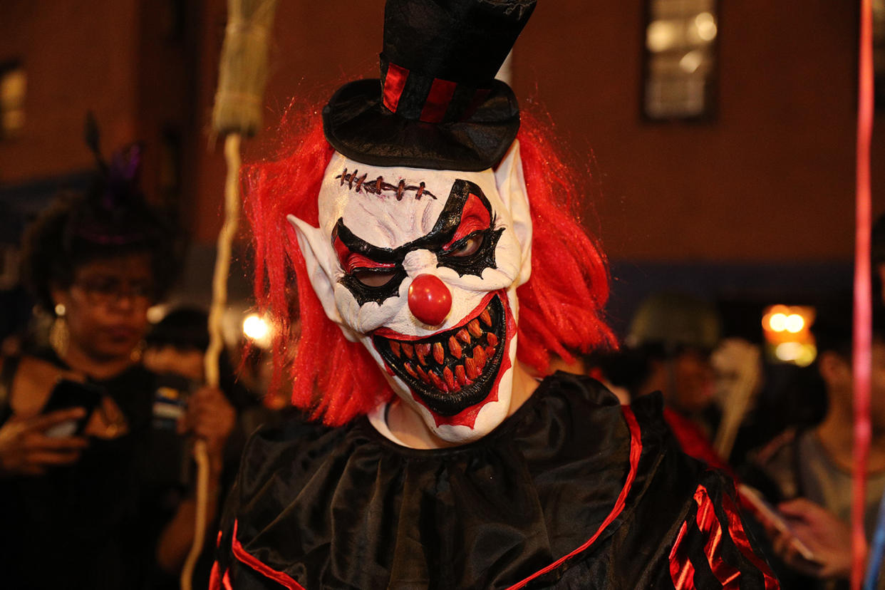 A scary clown mask is worn by a reveler during the Halloween Parade in New York City on Oct. 31, 2019. (Photo: Gordon Donovan/Yahoo News)