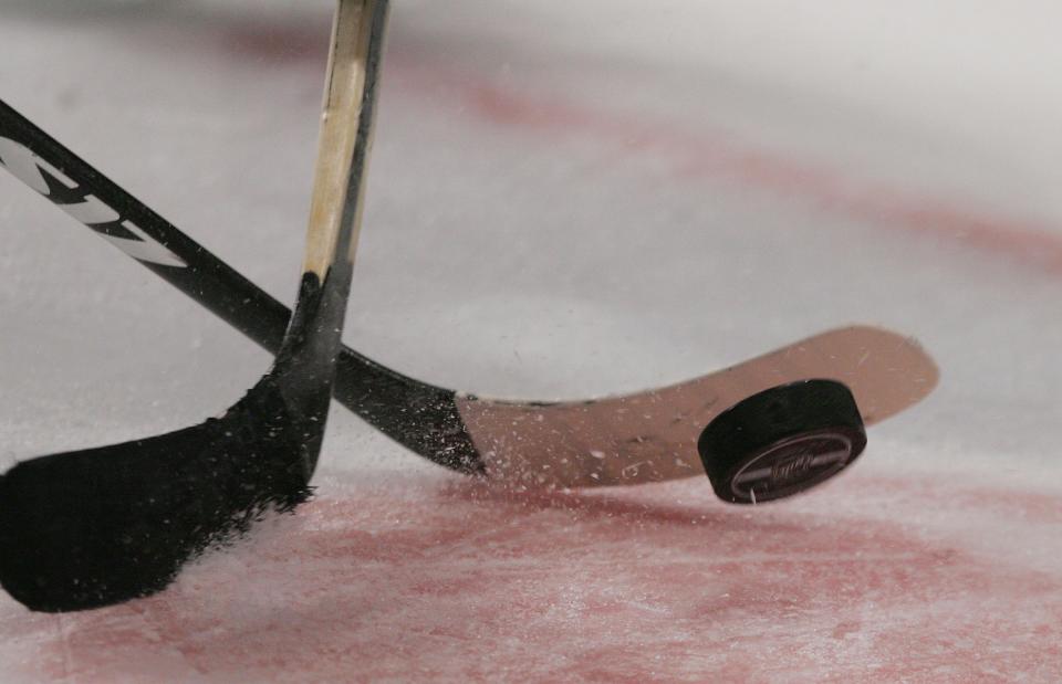 NEW YORK - APRIL 04: Sticks and the puck photogarphed during a faceoff between the New York Islanders and the New York Rangers on April 4, 2008 at Madison Square Garden in New York City. (Photo by Bruce Bennett/Getty Images)