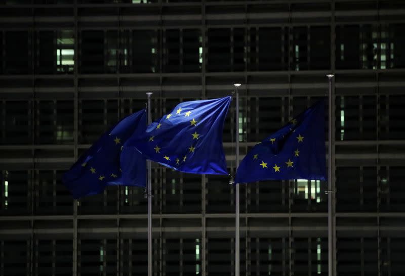 FILE PHOTO: European Union flags flutter outside the European Commission headquarters in Brussels