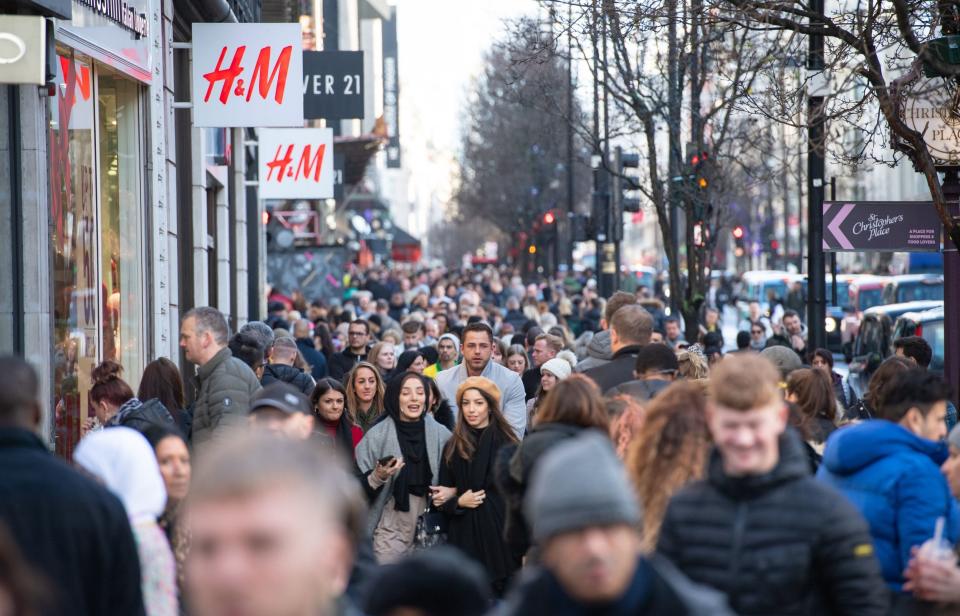 <p>Shoppers on Oxford Street </p>PA