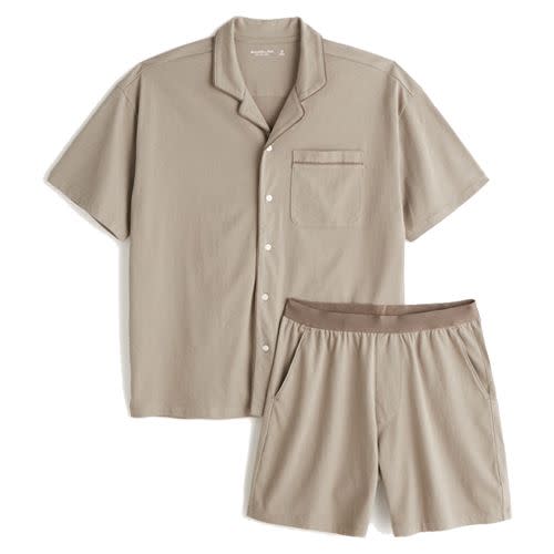 <p> <a class="link " href="https://www.abercrombie.com/shop/uk/p/button-up-sleep-set-49382820?seq=01&source=googleshopping&cmp=PLA%3AEVG%3A20%3AA%3AD%3AEU%3AX%3AGGL%3AX%3ASHOP%3AX%3AX%3AX%3AX%3Ax%3AA%26F+Adults_Google_Shopping_PLA_UK_Other_All+products_PRODUCT_GROUP&gclid=CjwKCAjw1ICZBhAzEiwAFfvFhDz2IvaEFQdamcgM1jXCZ10W4bOQ057dZHleihwQ0keCQ08Rkb20MhoCeR4QAvD_BwE&gclsrc=aw.ds" rel="nofollow noopener" target="_blank" data-ylk="slk:SHOP">SHOP</a></p><p>Whether you’re built like an A&F model or not, we’re confident you’ll look great in this super simple (and surprisingly forgiving) short set by the world-renowned American retailer. Choose between six sizes and two colourways: 'light brown' and 'dark blue'. </p><p>£60; <a href="https://www.abercrombie.com/shop/uk/p/button-up-sleep-set-49382820?seq=01&source=googleshopping&cmp=PLA%3AEVG%3A20%3AA%3AD%3AEU%3AX%3AGGL%3AX%3ASHOP%3AX%3AX%3AX%3AX%3Ax%3AA%26F+Adults_Google_Shopping_PLA_UK_Other_All+products_PRODUCT_GROUP&gclid=CjwKCAjw1ICZBhAzEiwAFfvFhDz2IvaEFQdamcgM1jXCZ10W4bOQ057dZHleihwQ0keCQ08Rkb20MhoCeR4QAvD_BwE&gclsrc=aw.ds" rel="nofollow noopener" target="_blank" data-ylk="slk:abercrombie.com" class="link ">abercrombie.com</a></p>