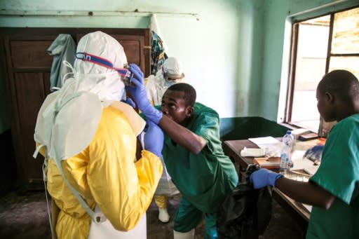 Health workers don protective equipment at Bikoro Hospital in northwest DR Congo -- the epicentre of the latest Ebola outbreak