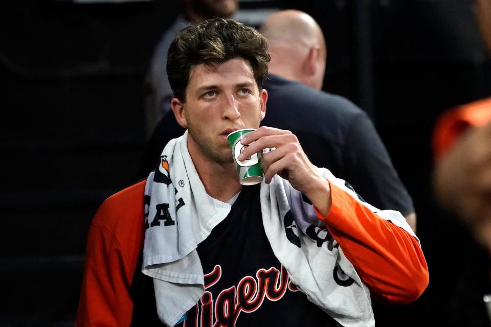 Tigers pitcher Beau Brieske looks at the scoreboard and takes a drink in the dugout during the fifth inning on Thursday, July 7, 2022, in Chicago.