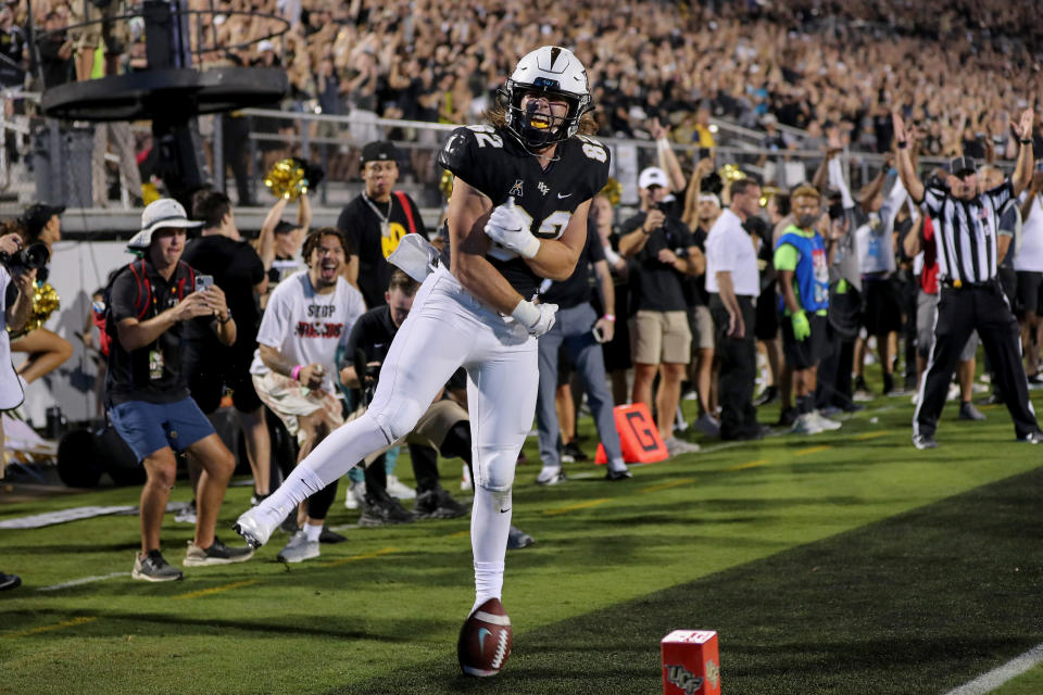 ORLANDO, FL - SEPTEMBER 02:   Alec Holler #82 of the UCF Knights celebrates his touchdown catch against Boise State Broncos at the Bounce House on September 2, 2021 in Orlando, Florida. (Photo by Alex Menendez/Getty Images)