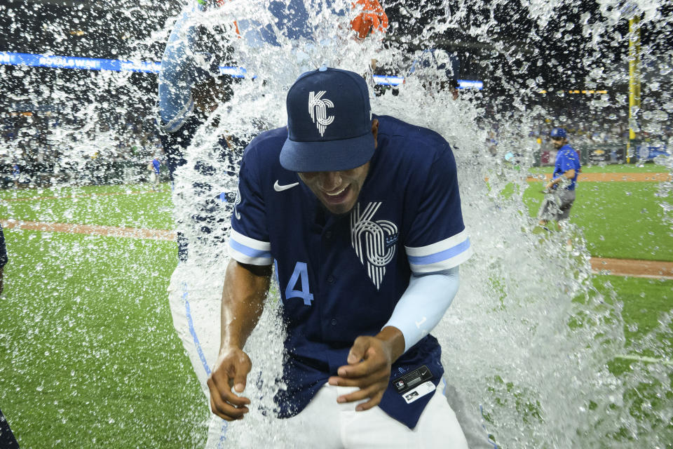 Kansas City Royals' Edward Olivares is doused after his two home runs led the team to a win over the Oakland Athletics in a baseball game, Friday, June 24, 2022, in Kansas City, Mo. (AP Photo/Reed Hoffmann)