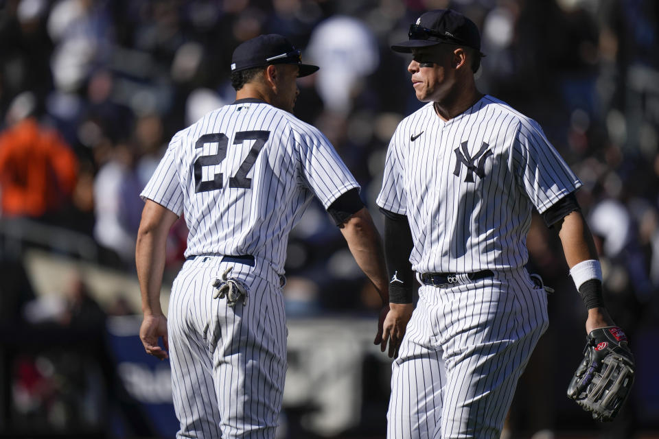 New York Yankees' Giancarlo Stanton, left, and Aaron Judge celebrate after the baseball game against the San Francisco Giants at Yankee Stadium Sunday, April 2, 2023, in New York. The Yankees defeated the Giants 6-0. (AP Photo/Seth Wenig)