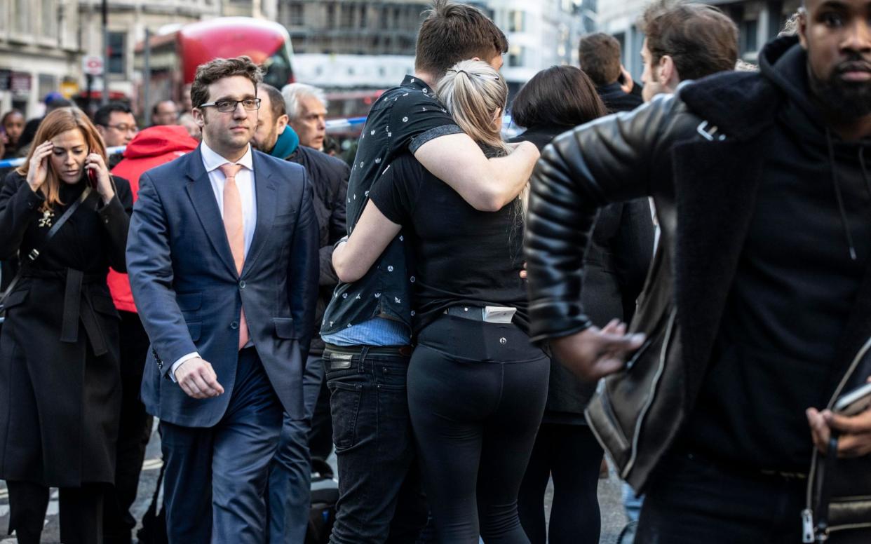 City workers leave the area near London Bridge after the attack - Jeff Gilbert