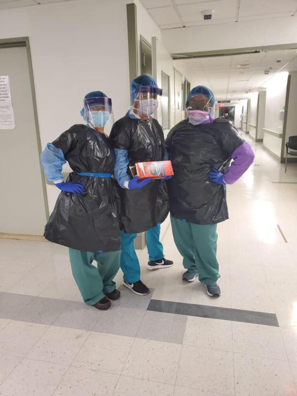 Photos show nurses wearing appropriate protective gear beneath black trash bags. (Joanne Loo)