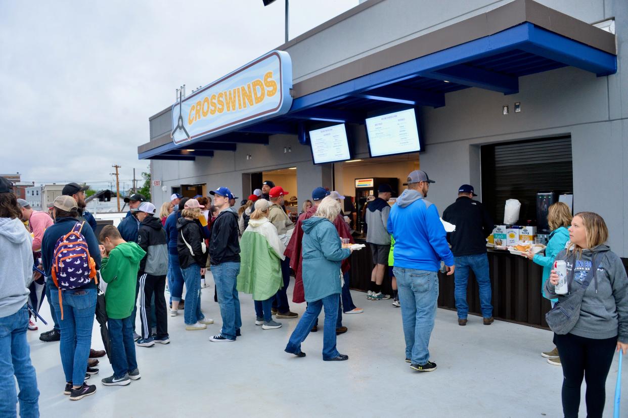 Fans in line at Crosswinds concession stand behind the first base side at Meritus Park for the Hagerstown Flying Boxcars' inaugural home game on May 4, 2024.