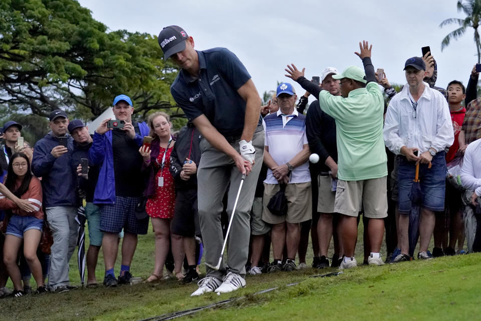 Brendan Steele chips onto the 10th green during a playoff against Cameron Smith during the final round of the Sony Open PGA Tour golf event, Sunday, Jan. 12, 2020, at Waialae Country Club in Honolulu. (AP Photo/Matt York)