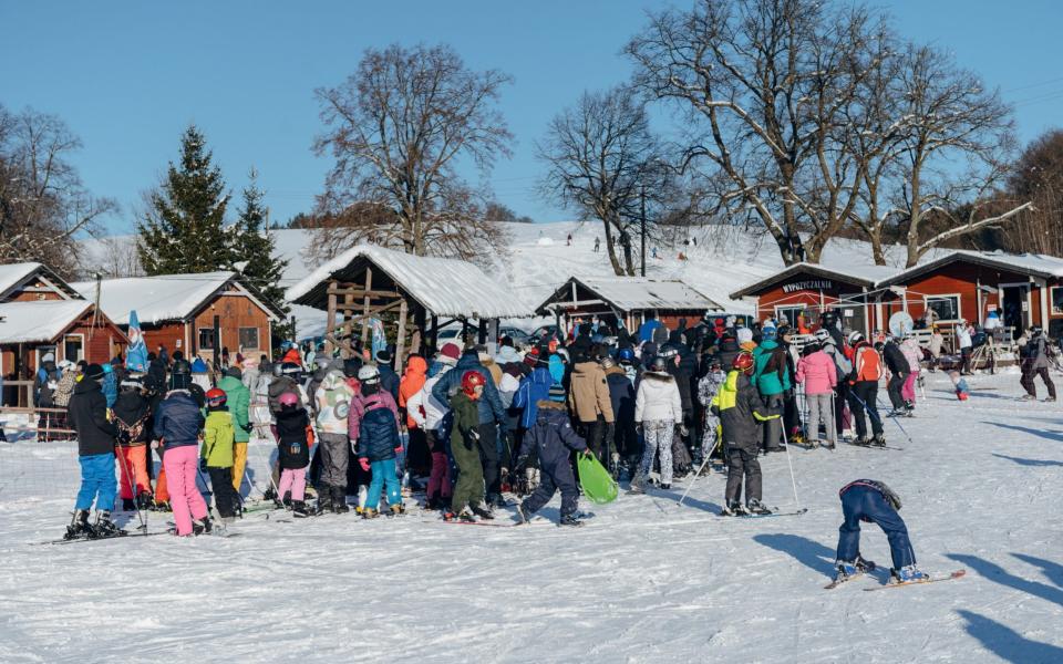 Skiers queue at the resort of Zakopane in Poland - Marek Podmokly