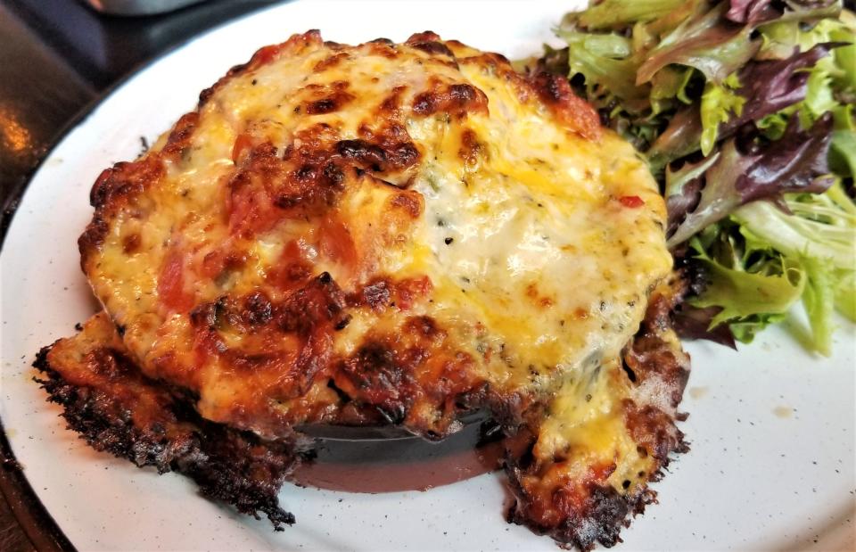 The tomato pie at Jennings Downtown Provisions in Bradenton contains tomato relish, croutons and pimento cheese, all made in house. It's served with a side salad of mixed greens and balsamic dressing.