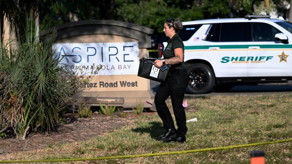 Law enforcement personnel investigate the scene of a shooting that happened around 3:30 a.m. Friday, May 24, 2024. The Manatee County Sheriff’s Office says Sean Calcutti is charged with attempted murder after he tried to break into a nursing home and shot a deputy in the arm.