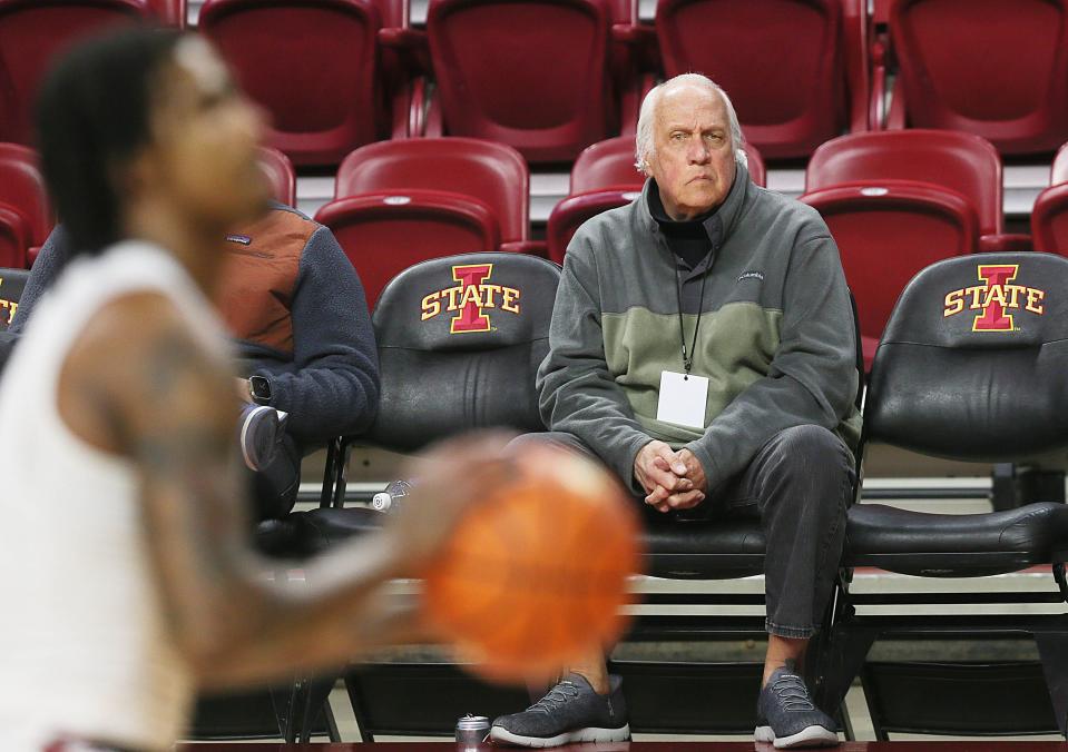 Des Moines Register columnist Randy Peterson watches pregame warm-ups before the Iowa State vs. Oklahoma men's basketball game at Hilton Coliseum on Feb. 28.