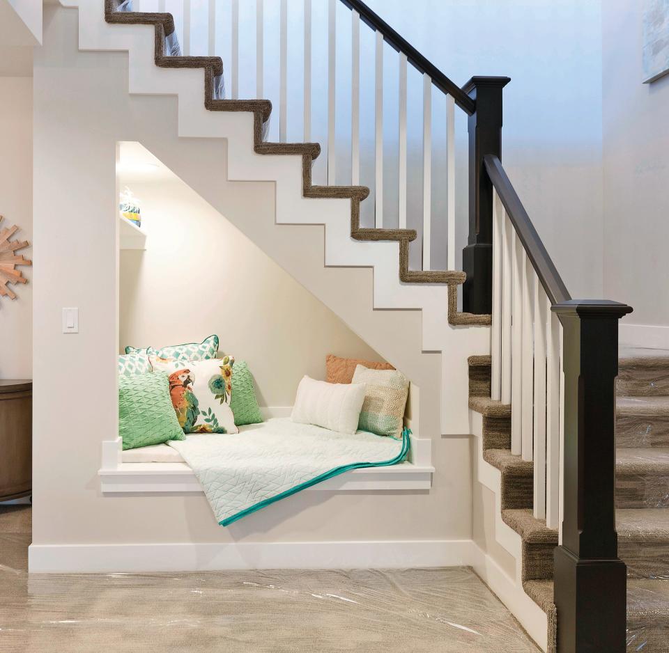 Reading nook underneath stairs with perfect ambience