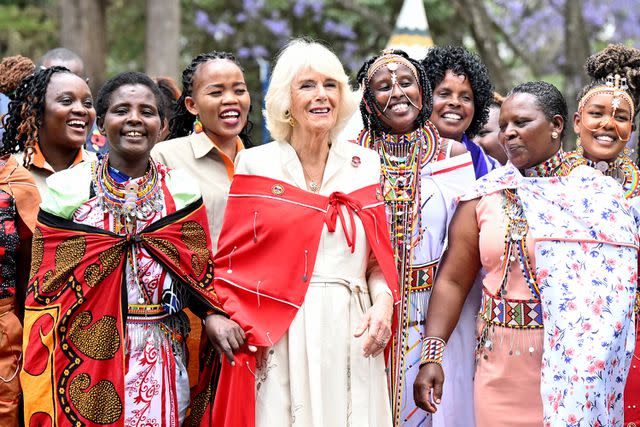 <p>Samir Hussein/WireImage</p> Queen Camilla receives a shuka at the Kenya Society for the Protection and Care for Animals on November 01.