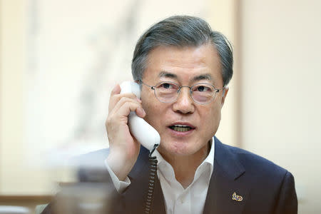 South Korean President Moon Jae-in talks on the phone with U.S. President Donald Trump at the Presidential Blue House in Seoul, South Korea, February 28, 2019. The Presidential Blue House/Yonhap via REUTERS/File Photo