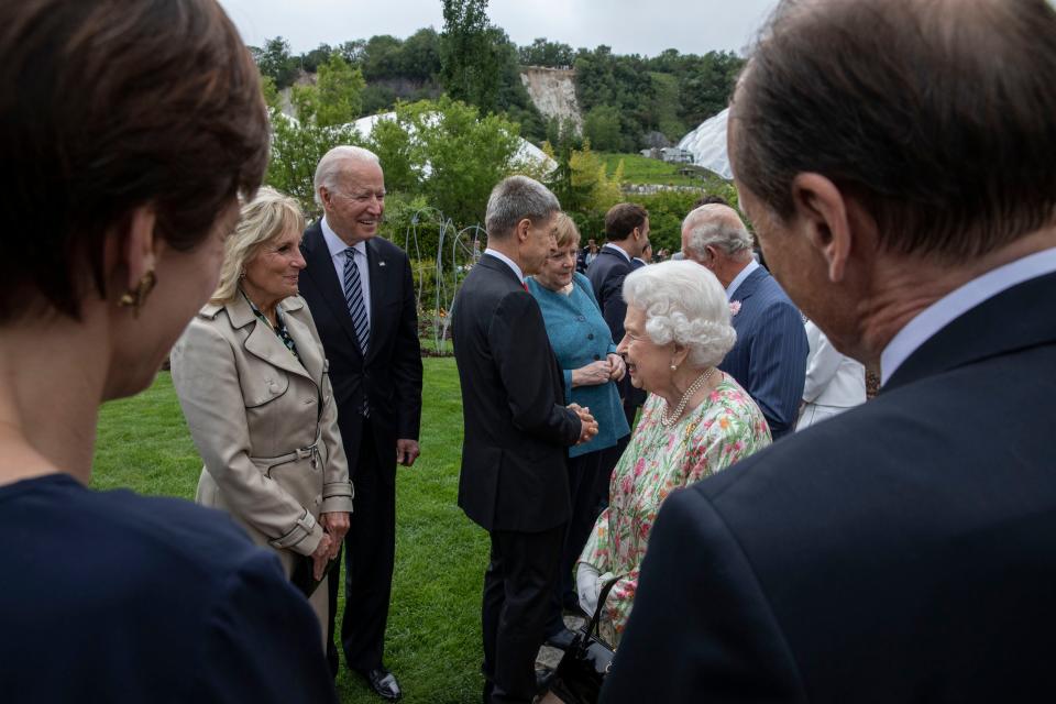 President Joe Biden and first lady Jill Biden greet Queen Elizabeth II of Britain at a reception for G-7 leaders at the Eden Project in Cornwall, England.