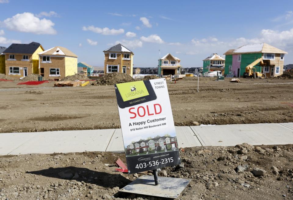 A sold sign is seen at an empty lot in a new sub division in Calgary, Alberta, April 7, 2015. (Reuters)