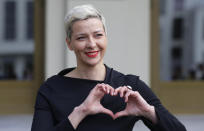 Maria Kolesnikova, a representative of Viktor Babariko gestures after the election commission meeting in Minsk, Belarus, Tuesday, July 14, 2020. The election commission denied to register Viktor Babariko, the former head of a Russia-owned bank who has been arrested on money laundering charges, for running in Belarus' presidential election set for August. (AP Photo/Sergei Grits)