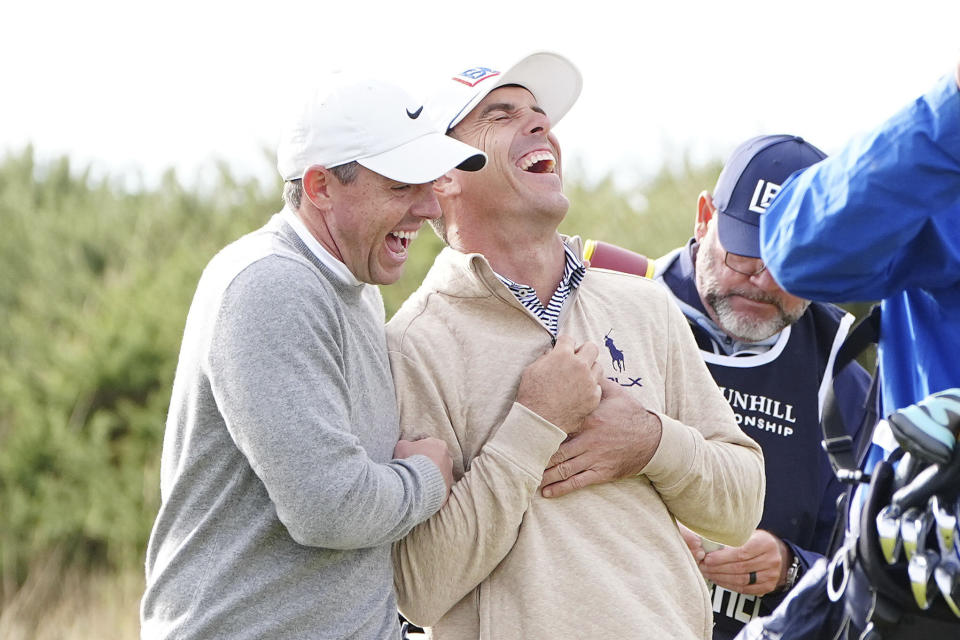 Northern Ireland's Rory McIlroy, left, and Billy Horschel of the U.S. react on the first tee on day two of the Alfred Dunhill Links Championship at Kingsbarns, Fife, Scotland, Friday Oct. 4, 2024. (Jane Barlow/PA via AP)