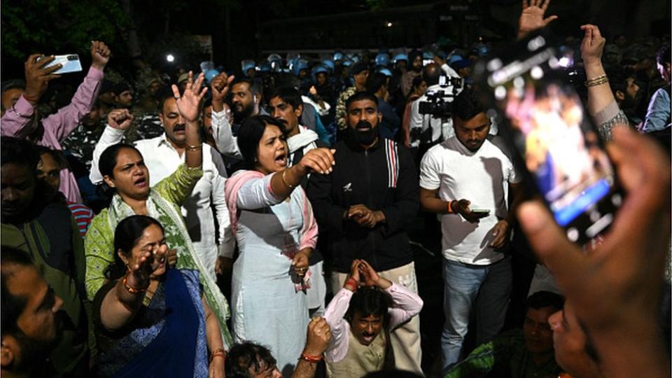 Aam Aadmi Party supporters shout slogans outside the house of Aam Aadmi Party leader and Delhi Chief Minister Arvind Kejriwal after he was arrested in a corruption case by the Enforcement Directorate in New Delhi on March 21, 2024.